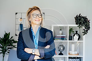 Portrait of smiling 50& x27;s stylish, confident mature businesswoman, middle aged company ceo director, experienced