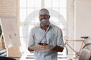 Portrait of smiling african American businessman posing in office