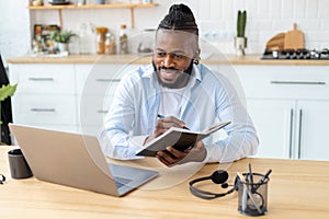 Portrait of smiling confident businessman using laptop computer Remote work concept