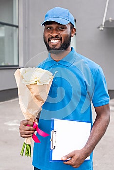 portrait of smiling african american delivery man