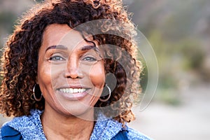 Portrait Of Smiling African American Senior Woman Outdoors In Countryside