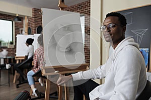 Portrait of smiling african american student attenting art class