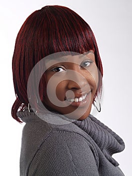 Portrait Smiling African American Woman In Gray Sweater