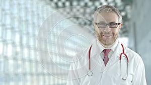 Portrait of a smiling assuring doctor in the modern hospital hall