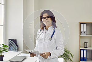 Portrait of smiling attractive female doctor with stethoscope