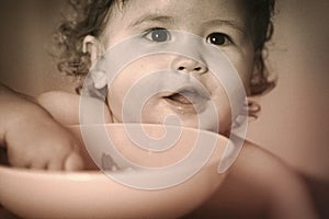 Portrait of smiling baby boy eating