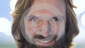 Portrait of smiling bearded adult man