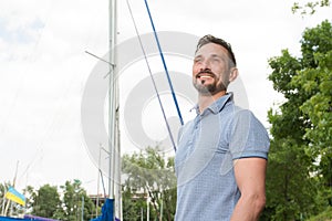 Portrait of Smiling bearded sailor. Happy man love adventures with boating. Summertime men vacation adventure concept.