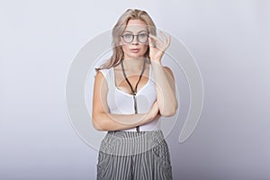 Portrait of smiling beautiful blonde woman looking camera