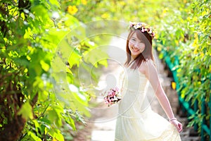 Portrait of smiling beautiful bride hold bouquet in her hands