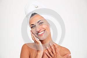 Portrait of a smiling beautiful woman with towel on head