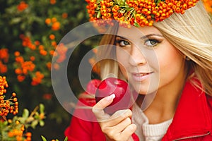 Portrait of smiling beautiful woman wreath of berries in autumn colors