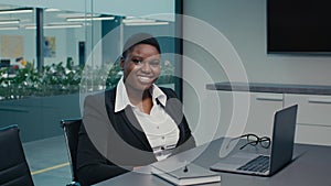 Portrait Of Smiling Black Businesswoman Posing At Workplace In Modern Office