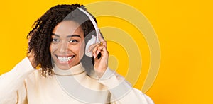 Portrait of smiling black girl enjoying music