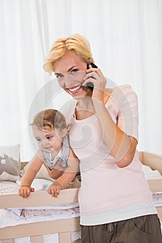 Portrait smiling blonde woman with his son phoning