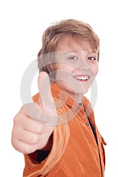 Portrait of a smiling boy holding his thumb up