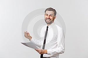 Portrait of a smiling business man with documents isolated on white background. Studio shot.