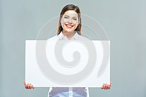 Portrait of smiling business woman with blank white sign board