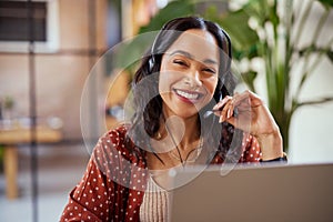Portrait of smiling business woman with headset