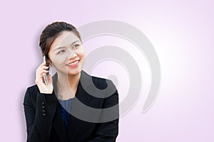 Portrait of smiling business woman using phone