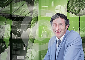 Portrait of smiling businessman against 3d image of graphs pie diagram and growth arrows