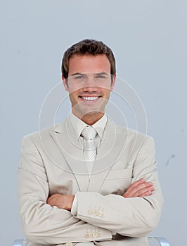 Portrait of smiling businessman with folded arms