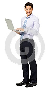 Portrait Of Smiling Businessman With Laptop
