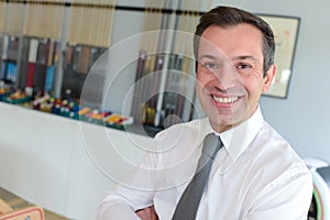 Portrait smiling businessman in office