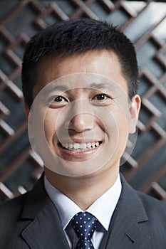 Portrait of Smiling Businessman, Outdoors, Beijing