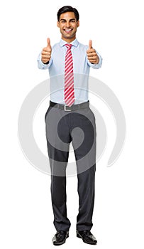 Portrait Of Smiling Businessman Showing Thumbs Up