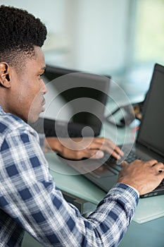 portrait smiling businessman at workplace