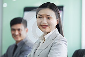 Portrait of Smiling Businesswoman with her Colleague