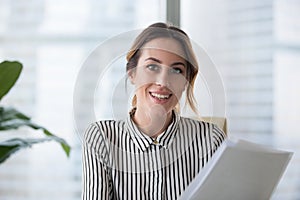 Portrait of smiling businesswoman looking at camera posing