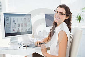 Portrait of smiling businesswoman using digitizer