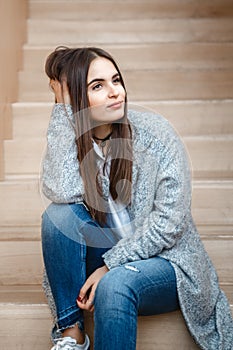 Portrait of smiling Caucasian brunette young beautiful girl woman model with long dark hair and brown eyes