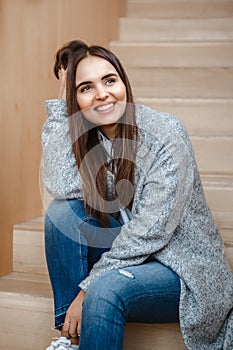 Portrait of smiling Caucasian brunette young beautiful girl woman model with long dark hair and brown eyes