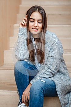 Portrait of smiling Caucasian brunette young beautiful girl woman model with long dark hair and brown eyes