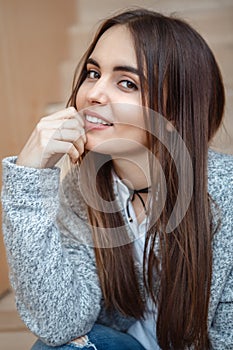 Portrait of smiling Caucasian brunette young beautiful girl woman model with long dark hair and brown eyes