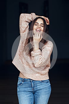 Portrait of smiling Caucasian brunette young beautiful girl woman model with long dark hair and brown eyes