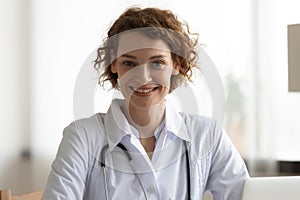 Portrait of smiling Caucasian female doctor in clinic