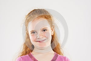 Portrait of Smiling Caucasian Redhaired Little Girl