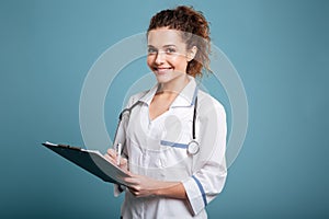 Portrait of a smiling cheerful medical nurse or doctor woman