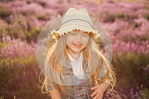 Portrait of smiling child. Contre-jour sunset shot.