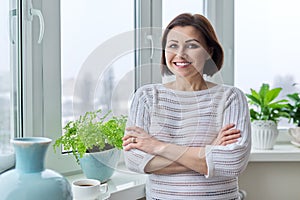 Portrait of a smiling confident woman 45 years old