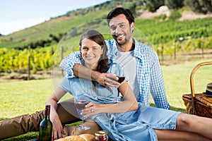 Portrait of smiling couple holding wineglasses