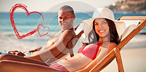 portrait of smiling couple on their deck chairs