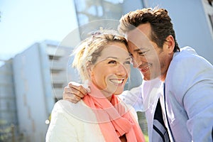 Portrait of smiling couple in urban area