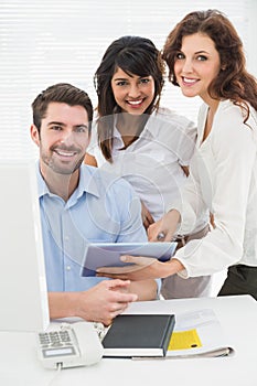 Portrait of smiling coworkers looking at camera