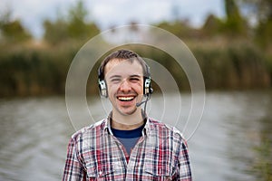 Portrait of a smiling customer service operator wearing a headset