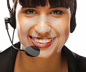 Portrait of smiling customer support female phone worker, over w